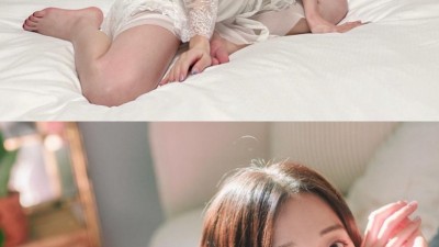 침대 위 화이트 슬립 쏘블리는 가슴골 명품 몸매