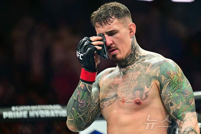 사상 초유 UFC 타이틀전 무효 선언…선수도, 관중도 맥 빠졌다